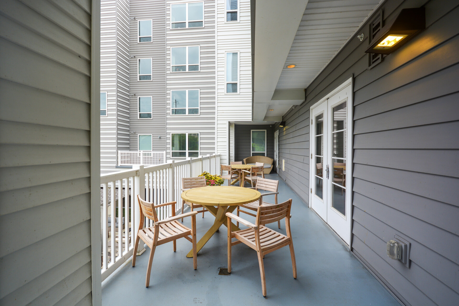 Deck with tables and view of residences